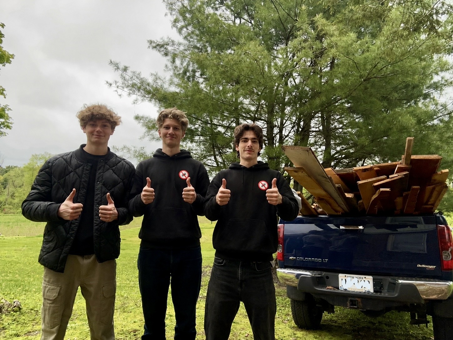 Junk Busters team with truck full of wood