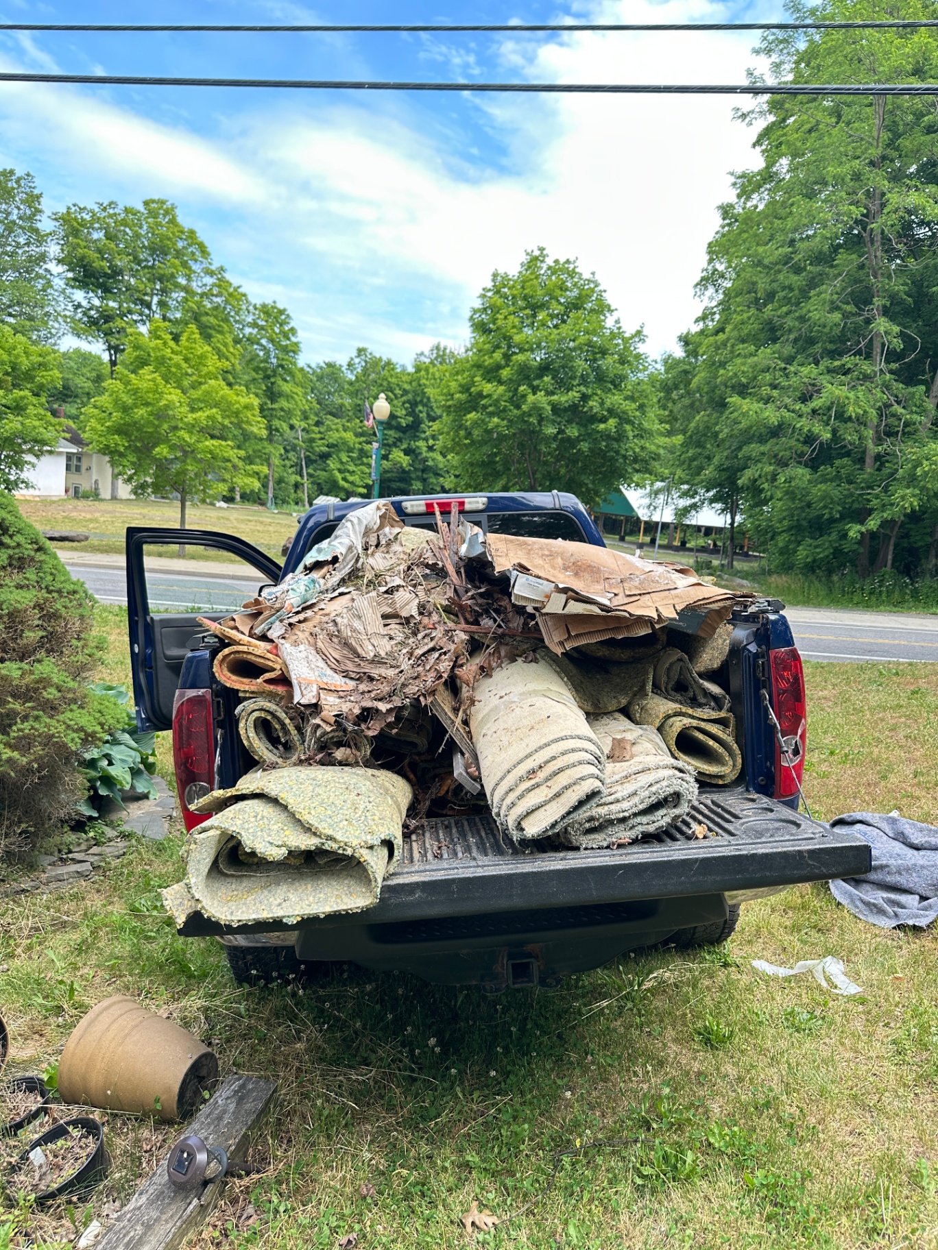 Truck loaded with carpet and debris