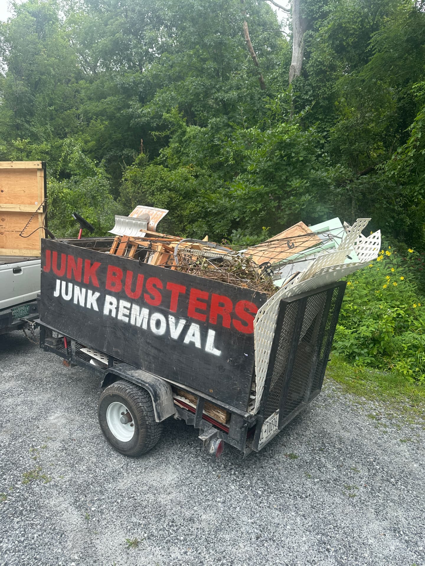 Junk Busters trailer filled with hauled junk and tools
